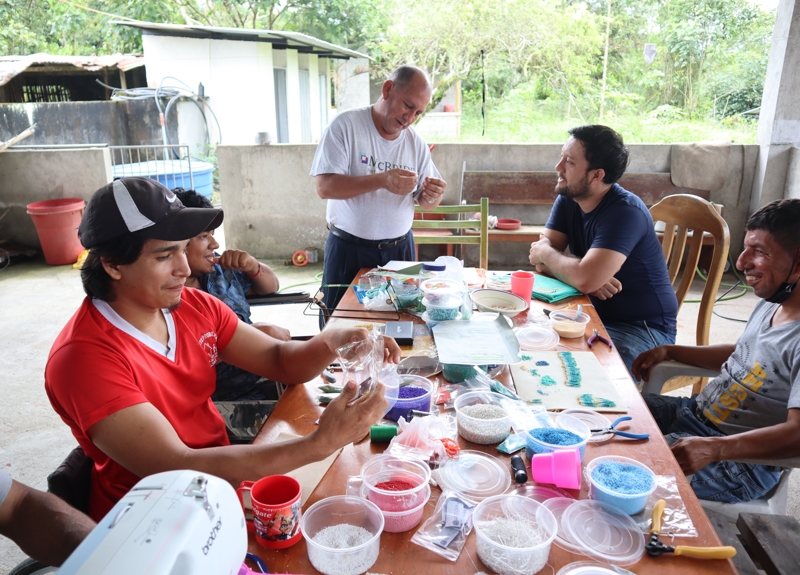 A group of people doing a craft activity in Ecuador